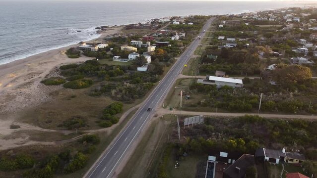 Highway long drive at Playa El Chorro beach Uruguay aerial
