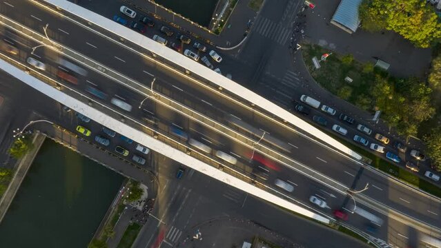 Motion Of Traffic riving In The Streets And Basarab Overpass Road Bridge At Dusk In Bucharest, Romania. - aerial hyperlapse
