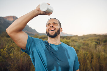 Sports man splash water bottle on face in nature hiking, running or outdoor exercise in Spain mountain adventure. Runner spray drinking water on head for cardio training, cool body sweat and wellness