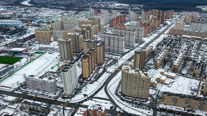 Winter city landscape from above. Aerial drone photo