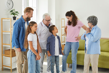 Happy family talking at home. Parents and grandparents communicating with children. Cheerful,...