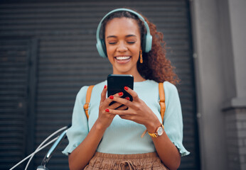 Phone, music and social media with a black woman streaming audio through a subscription service in the city. Travel, communication and text message with a young female networking in an urban town