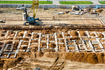 The initial stage of construction of a prefabricated reinforced concrete house. Foundation...