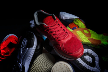 Sport shoes. Various sneakers on a dark background.