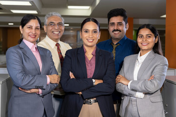 Successful group of business people at the office looking at the camera smiling. - obrazy, fototapety, plakaty