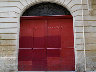 Double Wooden ancient Door old building entrance closed with arch on street city