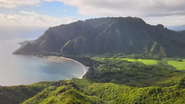 Aerial drone view of the ocean bay at Kahana Valley and Koolau Mountains in Oahu, Hawaii