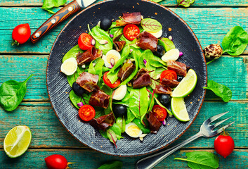 Spring raw salad with meat, top view