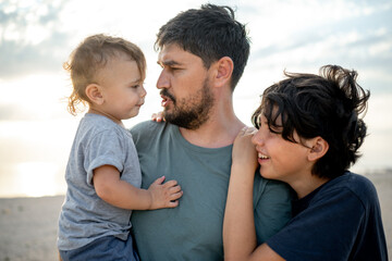 Father's Day. The father spends time with his sons. Father's love and care