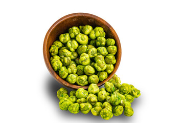 Wasabi coated green peas flowing out of falling wooden bowl isolated on white background .