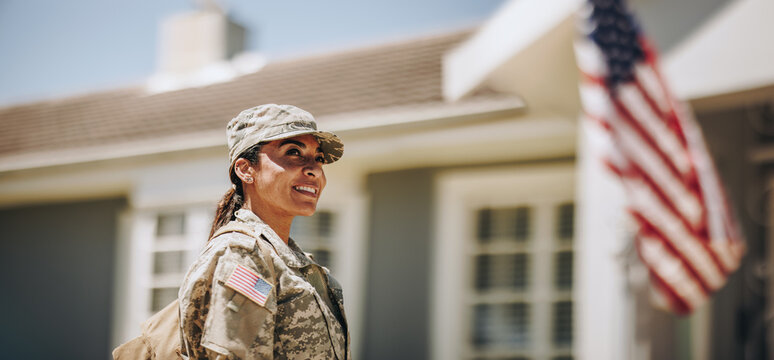 Happy female soldier returning home from the military - Powered by Adobe