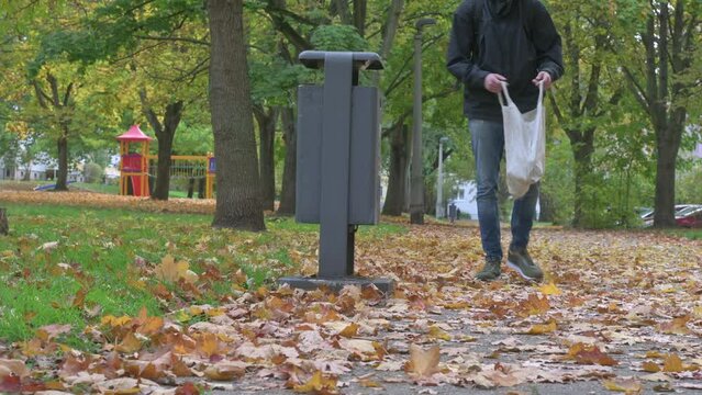 garbage container into which a man threw garbage but did not hit and went on