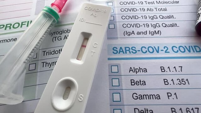 Rapid test, vaccine, syringe, blood test, and request form for healthcare check for diagnosis of COVID-19 virus disease. Tests and analysis diagnostic of Coronavirus antigens antibodies and immunizati