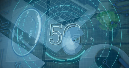 Image of scope scanning with 5g text and data processing over desk with laptop