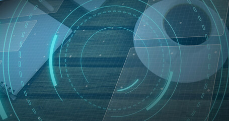 Image of scope scanning with 5g text and data processing over desk with laptop