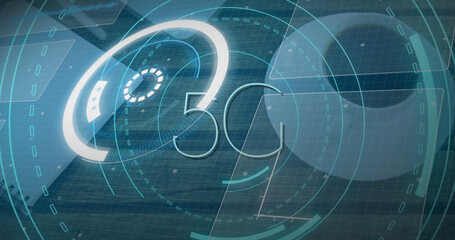 Image of scope scanning with 5g text and data processing over desk with laptop