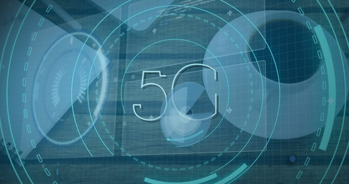 Image of scope scanning with 5g text and data processing over desk with laptop