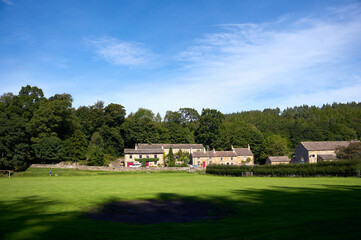 Stone houses of the small traditional rural village of Blanchland on a sunny autumn day in Northumberland on the border of County Durham, England, UK.