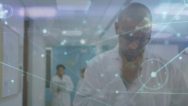 The video features a scientist using a digital tablet in their office
