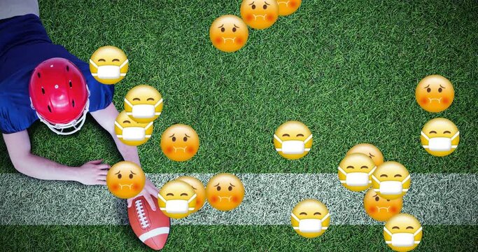 A football player scores a touchdown by running with the ball into the end zone