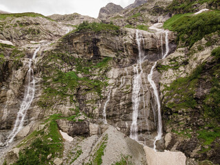Fototapeta na wymiar Aerial shot of mountains with waterfall.