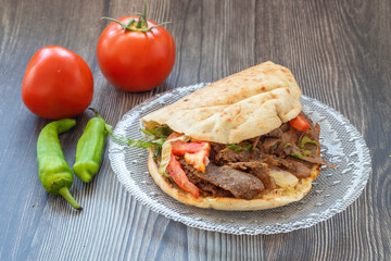 Turkish doner kebab, sandwich in chubby bread.