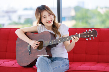 Studio shot of Millennial Asian young happy cheerful female teenager teen model in casual outfit...