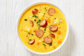 German potato soup with sausages in bowl