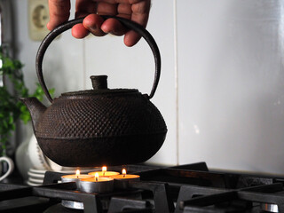 Boil water in a kettle on tea lights
