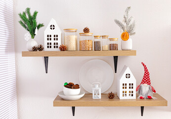 Front view of open kitchen shelves with eco jars for bulk products and Christmas decorations. cardboard white houses, natural cones.