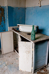 Fototapeta na wymiar Kitchen of abandoned apartment in the ghost town Pripyat in Chernobyl Exclusion Zone, Ukraine
