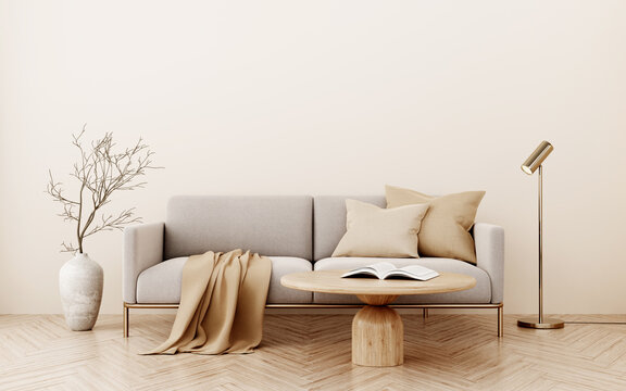 Decorated living room interior with gray sofa, floor vase, tree branch, brass lamp, coffee table and throw on empty warm beige background. Wall mockup in earthy tones. 3d illustration, 3d rendering