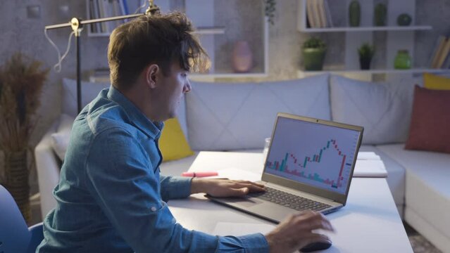 The man who lost in the stock market. The bankrupt man.
Loser man in stock market having nervous breakdown looking at charts from laptop.
