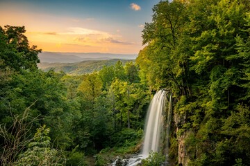 Naklejka premium landscape view of Falling Spring Falls Waterfall in Virginia under sunset sky