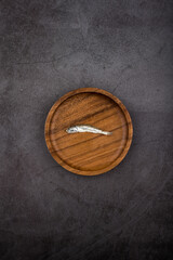 dried anchovy on dark background