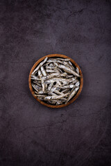dried anchovy on dark background