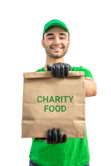 Free Food Distribution. Volunteer carrying food donation box. Young smiling man wearing uniform cap and t-shirt, gloves holds out grocery set for in-need people. White isolated background