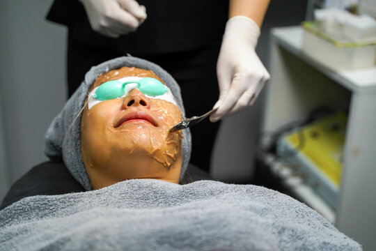 Closeup Asian Beauty Woman Receiving Skin Gel To Prepare The Color Light Therapy To Stimulate Facial Health.