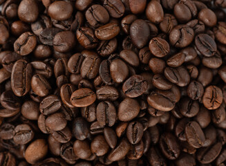 Full frame of roasted Robusta and Arabica coffee beans.