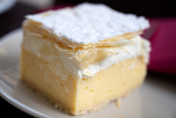 Close up of a Cremeschnitt, also known as vanilla slice or custard slice, is a custard and chantilly cream cake dessert commonly associated with the former Austro-Hungarian Monarchy