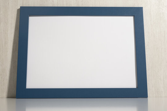 Horizontal photo frame mockup on white wall. blank diploma frame on white wooden wall background. blank diploma frame on white wall background. Size a3, a4, copy space