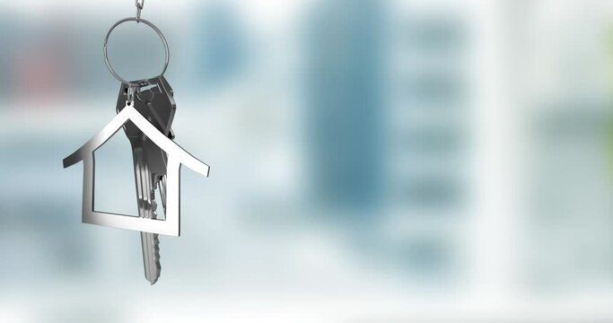 Animation of silver house key fob and key dangling over out of focus interiors with copy space