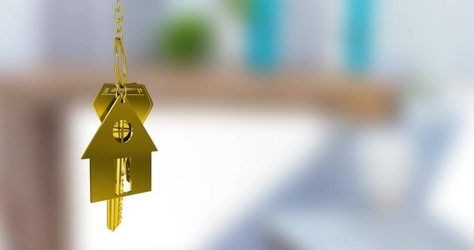Animation of gold house key fob and key dangling over out of focus interiors with copy space