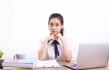 Asian female students taking an online class against a white background