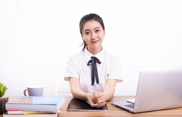 Asian female students taking an online class against a white background