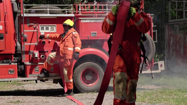 silhouette of Firefighters wear firefighting clothing with equipment. Learn skills and simulate firefighting events.	