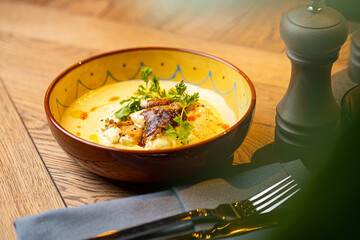 cheese cream soup with chicken in a restaurant