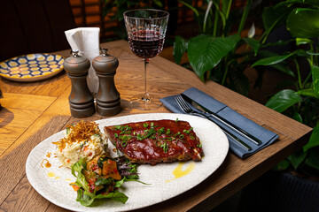 grilled pork ribs in sauce in a restaurant