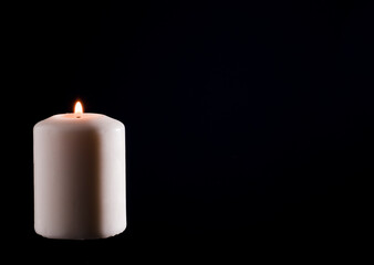 Wax candle with a blue dark back flame