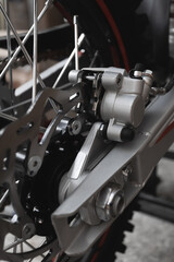 Motorcycle rears brake close up. disc pads and caliper.